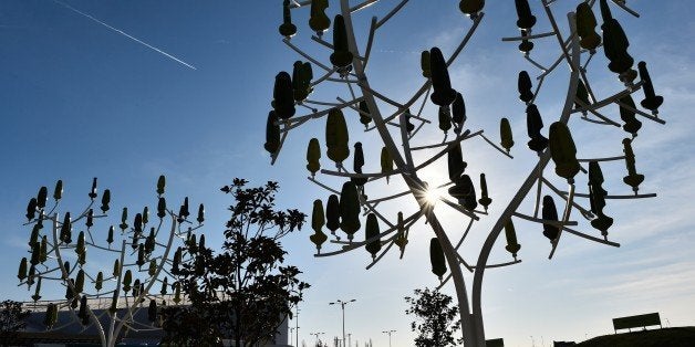 A picture taken on December 3, 2015 shows 'wind trees', a renewable energy innovation constructed in the shape of a tree, where each 'leaf' acts as a mini wind-turbine to generate electricity, displayed at the COP21, the United Nations conference on climate at Le Bourget, on the outskirts of Paris.More than 150 world leaders are meeting under heightened security, for the 21st Session of the Conference of the Parties to the United Nations Framework Convention on Climate Change (COP21/CMP11), also known as Paris 2015 from November 30 to December 11. / AFP / LOIC VENANCE (Photo credit should read LOIC VENANCE/AFP/Getty Images)