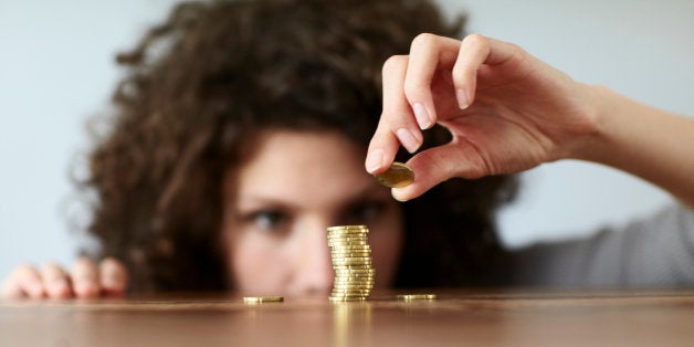 young woman with pile of coins