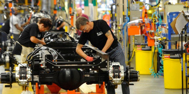 In this photo taken Aug. 12, 2015, workers assemble a truck at Ford Motor Companyâs Ohio Assembly Plant Wednesday, Aug. 12,