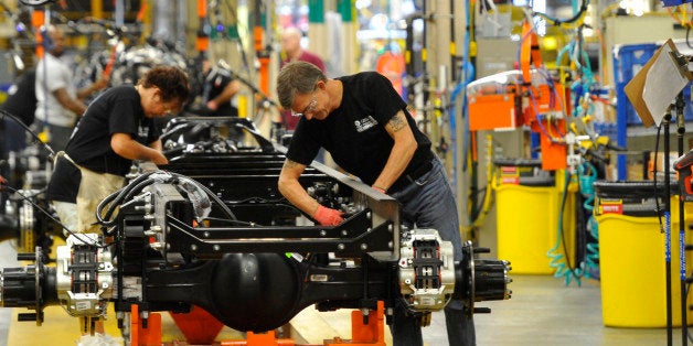 In this photo taken Aug. 12, 2015, workers assemble a truck at Ford Motor Companyâs Ohio Assembly Plant Wednesday, Aug. 12, in Avon Lake, Ohio. The United Auto Workers union on Friday, Nob. 6, 2015, has reached a tentative contract agreement with Ford. The contract covers 53,000 workers at 22 U.S. plants. (AP Photo/David Richard)