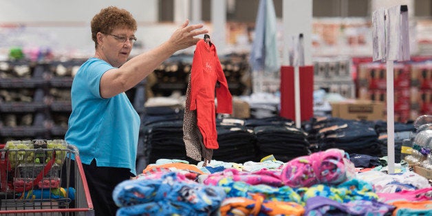 Linda Wentzel shops for clothing at a Costco Wholesale Corp. store in East Peoria, Illinois, U.S., on Tuesday, May 26, 2015. Costco Wholesale Corp., the largest U.S. warehouse-club chain, is expected to release third-quarter earnings figures on May 27. Photographer: Daniel Acker/Bloomberg via Getty Images 