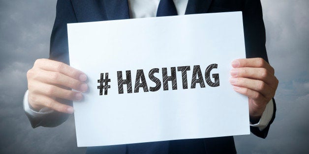 businessman hand holding hashtag text ,business idea , business concept