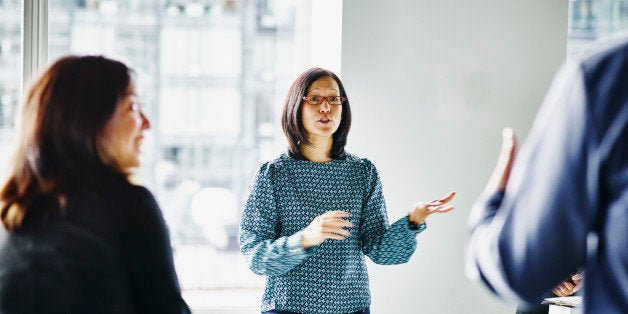 Businesswoman leading team project discussion in office