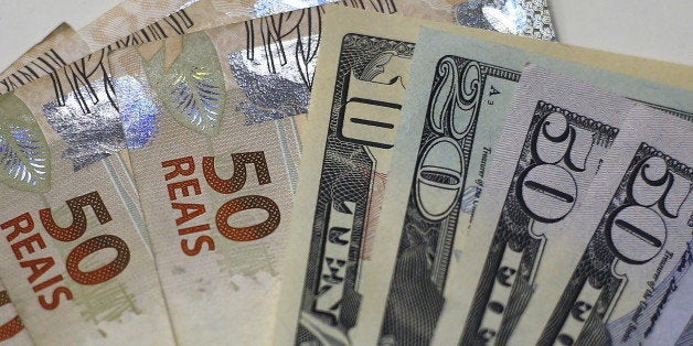 Brazilian Real and U.S. dollar notes are pictured at a currency exchange office in Rio de Janeiro, Brazil, in this September