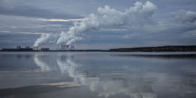 KLITTEN, GERMANY - FEBRUARY 14: Boxberg Power Station is reflected in the lake 'Baerwalder See' in Klitten on February 14, 2016. This lignite-fired power station is the fourth largest in Germany. (Photo by Florian Gaertner/Photothek via Getty Images)