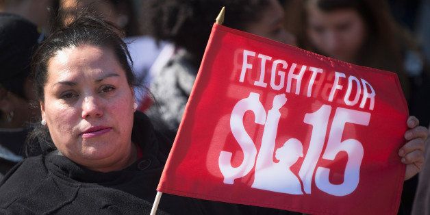 CHICAGO, IL - APRIL 14: Demonstrators demanding an increase in the minimum wage march in the streets on April 14, 2016 in Chicago, Illinois. The demonstrators marched to and protested in front of several locations, part of a day-long effort to draw attention to low-wage jobs. The demonstration was one of about 300 scheduled to take place nationwide today. (Photo by Scott Olson/Getty Images)