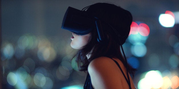 Woman using virtual reality headset at night with city lights in background