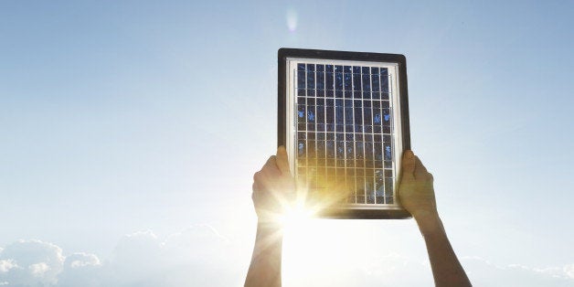 Woman hands with solar panel