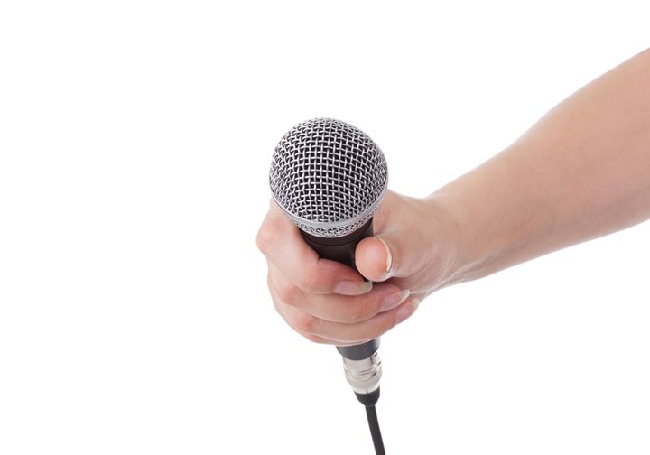 microphone in hand isolated on...