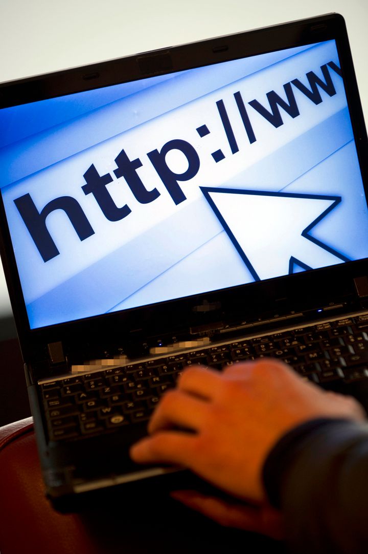A man looks at a webpage while connecting on the internet on March 15, 2013 in Paris. AFP PHOTO / LIONEL BONAVENTURE (Photo credit should read LIONEL BONAVENTURE/AFP/Getty Images)