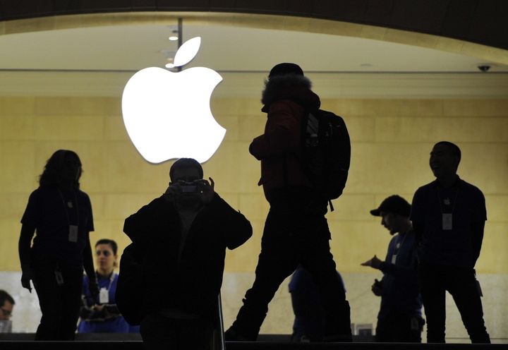 People walk past the Apple logo at the Apple Store at Grand Central Terminal in New York ON January 25, 2013. Apple shares slid about 12 percent on January 24 after the tech giant posted record profits and sales of its iPhones and iPads but offered a disappointing forecast for the coming months. AFP PHOTO/TIMOTHY A. CLARY (Photo credit should read TIMOTHY A. CLARY/AFP/Getty Images)