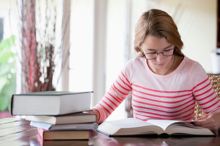 Busy girl doing homework