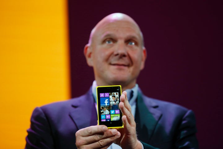 SAN FRANCISCO - OCTOBER 29: Microsoft CEO Steve Ballmer holds a Nokia Lumia 920 smartphone during a Windows Phone 8 launch ev