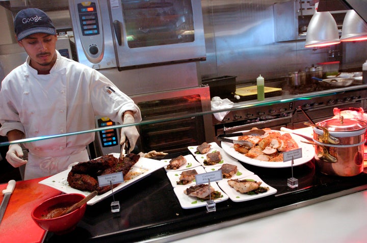 UNITED STATES - MAY 16: Grill cook Antonio Paez tends to a beef tri-tip in a cafeteria at Google Inc. in Mountain View, Cali