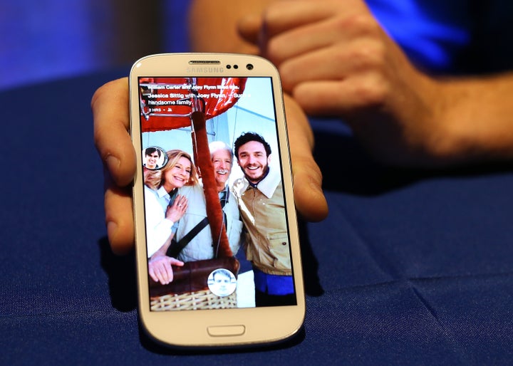 MENLO PARK, CA - APRIL 04: A Facebook employee holds a phone that is running the new 'Home' program during an event at Facebook headquarters during an event at Facebook headquarters on April 4, 2013 in Menlo Park, California. Facebook CEO Mark Zuckerberg announced a new product for Android called Facebook Home as well as the new HTC First phone that will feature the new software. (Photo by Justin Sullivan/Getty Images)