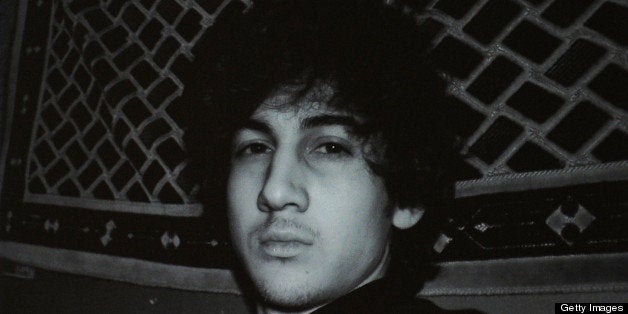 A man looks in Moscow on April 19, 2013, at a computer screen displaying an undated picture the 19-year-old Dzhokhar Tsarnaev