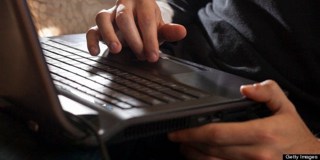 Man at home working on computer