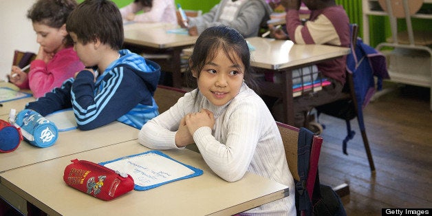 PARIS, FRANCE - FEBRUARY: Children sit in a classroom of a school in the Mairie de Paris Primary School during February 2012