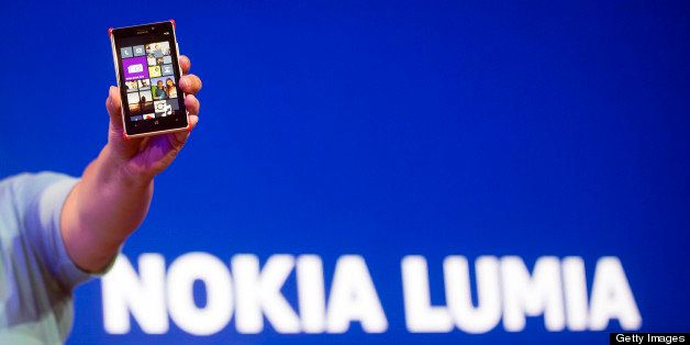 Jo Harlow, head of smartphones at Nokia Oyj, displays the screen of a Nokia Lumia 925 Windows Phone during a news conference to launch the handset in London, U.K., on Tuesday, May, 14, 2013. Nokia Oyj, striving to win back users from Apple Inc. and Samsung Electronics Co., unveiled a version of its Lumia smartphone with a metal design and improved camera. Photographer: Simon Dawson/Bloomberg via Getty Images 