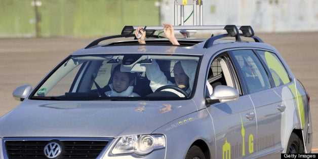 The driverless car 'Made in Germany' (MIG), which from the outside looks like a regular Volkswagen Passat with a camera on top, is being put through its paces at Berlin's disused Tempelhof airport, October 13, 2010. German scientists unveiled the latest self-driving car, a phenomenon that its proponents say will sharply reduce accidents, help the environment and transform cities. The car, dubbed the 'MIG' by its engineers at Berlin's Free University (FU), uses cameras, laser scanners and satellite navigation to 'see' other vehicles and pedestrians and deal with traffic situations. AFP PHOTO / ODD ANDERSEN (Photo credit should read ODD ANDERSEN/AFP/Getty Images)