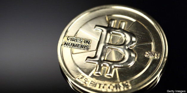 A twenty-five bitcoin is arranged for a photograph in Tokyo, Japan, on Thursday, April 25, 2013. The digital currency, which carries the unofficial ticker symbol of BTC, was unveiled in 2009 by an unidentified programmer, or group of programmers, under the name of Satoshi Nakamoto. Supply is capped at 21 million Bitcoins and managed by a software algorithm embedded into the digital currency?s design, rather than a monetary authority such as a central bank. Photographer: Tomohiro Ohsumi/Bloomberg via Getty Images