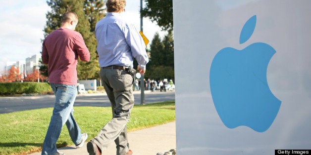 Apple employees walk towards the Apple Headquarters to attend Apple co-founder Steve Jobs' memorial service in Cupertino, California, on October 19, 2011. Apple stores across the country shut their doors for a few hours on Wednesday to allow its employees to participate in a staff celebration of the life of Jobs. AFP Photo/Kimihiro Hoshino (Photo credit should read KIMIHIRO HOSHINO/AFP/Getty Images)