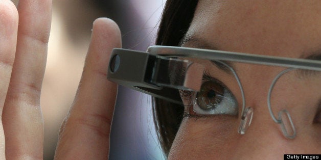 SAN FRANCISCO, CA - MAY 17: An attendee tries Google Glass during the Google I/O developer conference on May 17, 2013 in San Francisco, California. Eight members of the Congressional Bi-Partisan Privacy Caucus sent a letter to Google co-founder and CEO Larry Page seeking answers to privacy questions and concerns surrounding Google's photo and video-equipped glasses called 'Google Glass'. The panel wants to know if the high tech eyeware could infringe on the privacy of Americans. Google has been asked to respond to a series of questions by June 14. (Photo by Justin Sullivan/Getty Images)