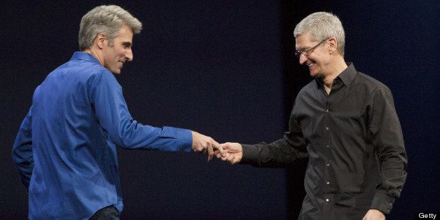 SAN FRANCISCO, CA - JUNE 10: Apple CEO Tim Cook (R) welcomes Craig Federighi, vice president of Software Engineering, on stage during a keynote address during the 2013 Apple WWDC at the Moscone Center on June 10, 2013 in San Francisco, California. Apple introduced a new mobile operatng system iOS 7, hardware upgrades and a new operating system OS X Mavericks during the keynote qaddress. The annual developer conference runs through June 14. (Photo by Kim White/Getty Images)