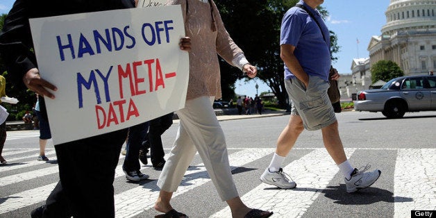 WASHINGTON, DC - JUNE 14: Protesters rally outside the U.S. Capitol against the NSA's recently detailed surveillance programs June 13, 2013 in Washington, DC. Members of various action groups gathered to protest the ÒNational Security Agency's abuses of law abiding Americans. (Photo by Win McNamee/Getty Images)