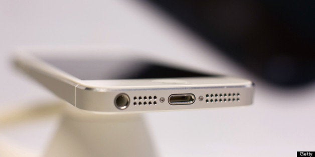 The dock connector is seen on an Apple Inc. iPhone 5 on display during a launch event organized by SK Telecom Co. in Seoul, South Korea, on Friday, Dec. 7, 2012. The iPhone 5 went on sale in South Korea today. Photographer: SeongJoon Cho/Bloomberg via Getty Images