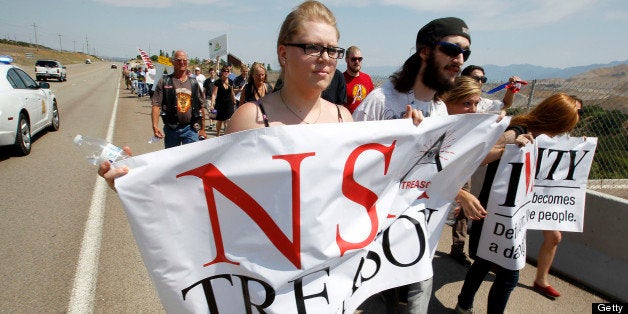 Protesters march along the roadside to the new National Security Agency (NSA) Utah Data Center being built in Bluffdale, Uta