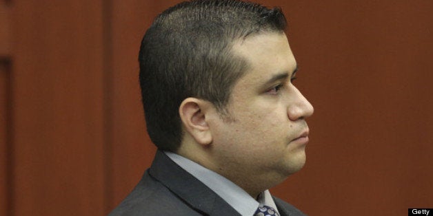 SANFORD, FL - JULY 10: George Zimmerman stands to identify himself Olivia Bertalan as she testifies on behalf of the defense during Zimmerman's murder trial during his murder trial in Seminole circuit court July 10, 2013 in Sanford, Florida. Zimmerman has been charged with second-degree murder for the 2012 shooting death of Trayvon Martin. (Photo by Gary W. Green-Pool/Getty Images)