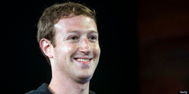 Mark Zuckerberg, chief executive officer of Facebook Inc., smiles while speaking during an event at the company's headquarter