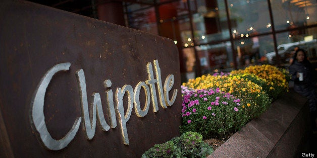 The Chipotle Mexican Grill Inc. logo is displayed in front of a location in New York, U.S., on Wednesday, Oct. 17, 2012. Chipotle, the best- performing restaurant stock in the Standard & Poor's 500 Index last year, is expected to release earnings data on Oct. 18. Photographer: Scott Eells/Bloomberg via Getty Images