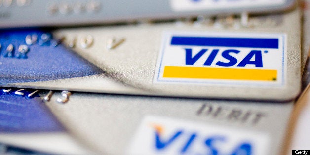 UNITED STATES - JULY 30: Visa logos appear on credit and debit cards arranged for a photograph in New York, U.S., on Thursda