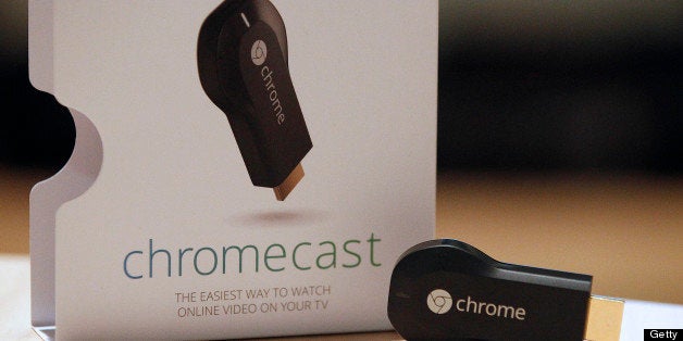 The new Google ChromeCast is displayed for a photograph during an event in San Francisco, California, U.S., on Wednesday, July 24, 2013. Google Inc., owner of the worlds most popular search engine, today unveiled an updated version of its Nexus 7 tablet as it steps up efforts against rivals such as Apple Inc. and Microsoft Corp. Photographer: Tony Avelar/Bloomberg via Getty Images