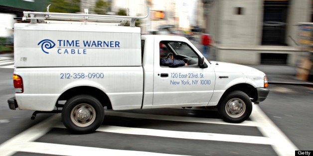 UNITED STATES - OCTOBER 18: A Time Warner Cable trucks turns a corner on a New York street Wednesday, October 18, 2006 Time Warner Inc.'s cable unit filed for an initial public offering that may value the business at more than $40 billion and give investors a stake in the second-largest U.S. cable-television provider for the first time. (Photo by Daniel Acker/Bloomberg via Getty Images)