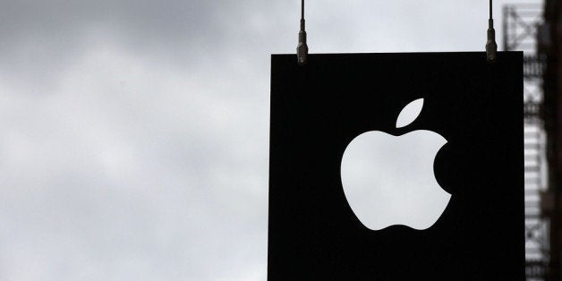 NEW YORK, NY - JULY 23: The Apple logo hangs in front of an Apple store on July 23, 2013 in New York City. Apple is due to report third-quarter earnings after the markets close Tuesday. Apple, the California based technology company, has watched its stock sink to $427.68 a share from an all-time high of $702 last September. The company is under pressure to release a new blockbuster product. (Photo by Spencer Platt/Getty Images)