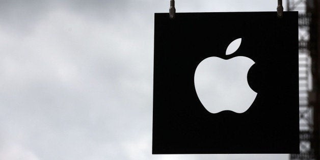 NEW YORK, NY - JULY 23: The Apple logo hangs in front of an Apple store on July 23, 2013 in New York City. Apple is due to report third-quarter earnings after the markets close Tuesday. Apple, the California based technology company, has watched its stock sink to $427.68 a share from an all-time high of $702 last September. The company is under pressure to release a new blockbuster product. (Photo by Spencer Platt/Getty Images)