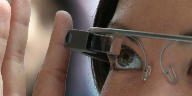 SAN FRANCISCO, CA - MAY 17: An attendee tries Google Glass during the Google I/O developer conference on May 17, 2013 in San Francisco, California. Eight members of the Congressional Bi-Partisan Privacy Caucus sent a letter to Google co-founder and CEO Larry Page seeking answers to privacy questions and concerns surrounding Google's photo and video-equipped glasses called 'Google Glass'. The panel wants to know if the high tech eyeware could infringe on the privacy of Americans. Google has been asked to respond to a series of questions by June 14. (Photo by Justin Sullivan/Getty Images)