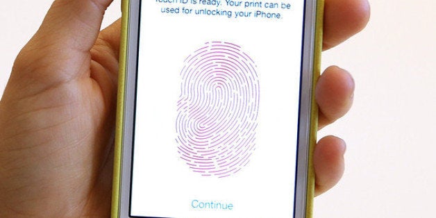 CUPERTINO, CA - SEPTEMBER 10: The new iPhone 5S with fingerprint technology is displayed during an Apple product announcemen