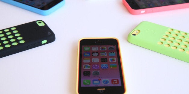 CUPERTINO, CA - SEPTEMBER 10: The new iPhone 5C is displayed during an Apple product announcement at the Apple campus on September 10, 2013 in Cupertino, California. The company launched the new iPhone 5C model that will run iOS 7 is made from hard-coated polycarbonate and comes in various colors and the iPhone 5S that features fingerprint recognition security. (Photo by Justin Sullivan/Getty Images)