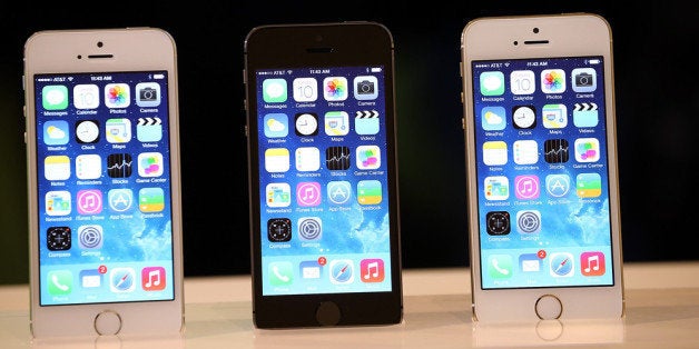 CUPERTINO, CA - SEPTEMBER 10: The new iPhone 5S is displayed during an Apple product announcement at the Apple campus on September 10, 2013 in Cupertino, California. The company launched the new iPhone 5C model that will run iOS 7 is made from hard-coated polycarbonate and comes in various colors and the iPhone 5S that features fingerprint recognition security. (Photo by Justin Sullivan/Getty Images)