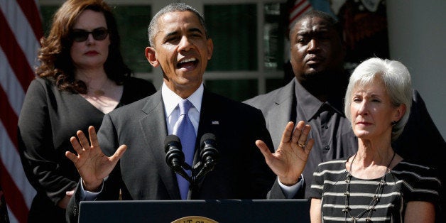 WASHINGTON, DC - OCTOBER 01: U.S. President Barack Obama delivers remarks about the launch of the Affordable Care Act's health insurance marketplaces and the first federal government shutdown in 17 years as he's joined by U.S. Health and Human Services Secretary Kathleen Sebelius (R) and Americans who will benefit from the Affordable Care Act in the Rose Garden of the White House October 1, 2013 in Washington, DC. House Republicans and Senate Democrats continue to volley legislation back and forth as they battle over a budget to keep the government running and delaying or defunding 'Obamacare.' (Photo by Win McNamee/Getty Images)