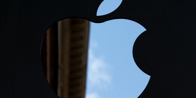 FILE PHOTO: The Apple Inc. logo sits on display outside the company's store in Amsterdam, Netherlands, on Monday Sept. 16, 2013. Burberry Group said Christopher Bailey will become chief executive officer of the largest British luxury-goods producer, as CEO Angela Ahrendts departs the company to work at Apple Inc. Photographer: Jasper Juinen/Bloomberg via Getty Images