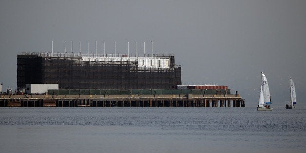 SAN FRANCISCO, CA - OCTOBER 30: A barge under construction is docked at a pier on Treasure Island on October 30, 2013 in San Francisco, California. Mystery barges with construction of shipping containers have appeared in San Francisco and Portland, Maine, prompting online rumors that the barges are affiliated with a Google project. (Photo by Justin Sullivan/Getty Images)