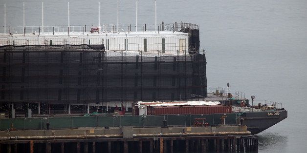 SAN FRANCISCO, CA - OCTOBER 30: A barge under construction is docked at a pier on Treasure Island on October 30, 2013 in San Francisco, California. Mystery barges with construction of shipping containers have appeared in San Francisco and Portland, Maine, prompting online rumors that the barges are affiliated with a Google project. (Photo by Justin Sullivan/Getty Images)