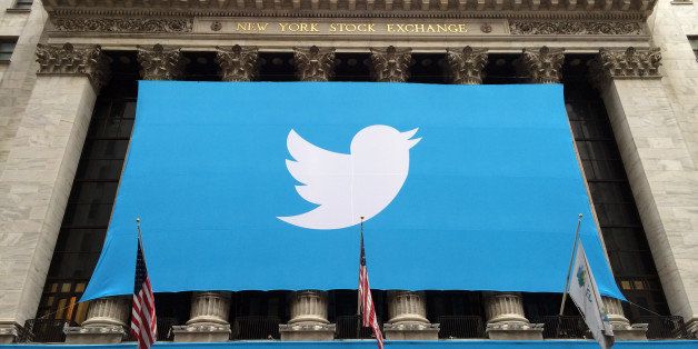 A banner with the Twitter Inc. logo hangs outside the New York Stock Exchange (NYSE) in New York, U.S., on Thursday, Nov. 7, 2013. Twitter Inc. raised $1.82 billion in its initial public offering, seizing on surging investor demand to price at a more expensive valuation than rival Facebook Inc. Photographer: Scott Eells/Bloomberg via Getty Images