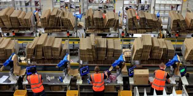 SWANSEA, WALES - NOVEMBER 24: Staff at the Amazon Swansea fulfilment centre process orders as they prepare their busiest time of the year on November 24, 2011 in Swansea, Wales. The 800,000 sq ft fulfilment centre, one the largest of Amazon's six in the UK and the also the world, is gearing up for for both 'Black Friday' and 'Cyber Monday'. Black Friday is traditionally the discount shopping day that follows Thanksgiving in America and signals the start of the Christmas shopping period. In 2010 it is was reported that over 45bn USD was spent by shoppers in America over 'Black Friday' weekend. Cyber Monday, which this year is Monday December 5, and is predicted to be the UK's busiest online shopping day of the year with over 2 million orders expected to be made. (Photo by Matt Cardy/Getty Images)