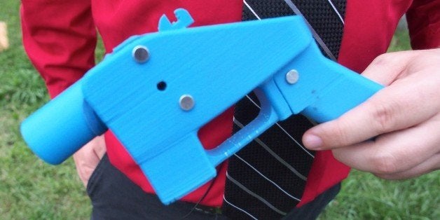 TO GO WITH AFP STORY BY ROBERT MACPHERSONClose-up view of the Liberator pistol in the hands of software engineer Travis Lerol on July 11, 2013. The single-shot gun is the first that can be made entirely from plastic parts forged with a 3D printer. AFP PHOTO / Robert MacPherson (Photo credit should read Robert MacPherson/AFP/Getty Images)